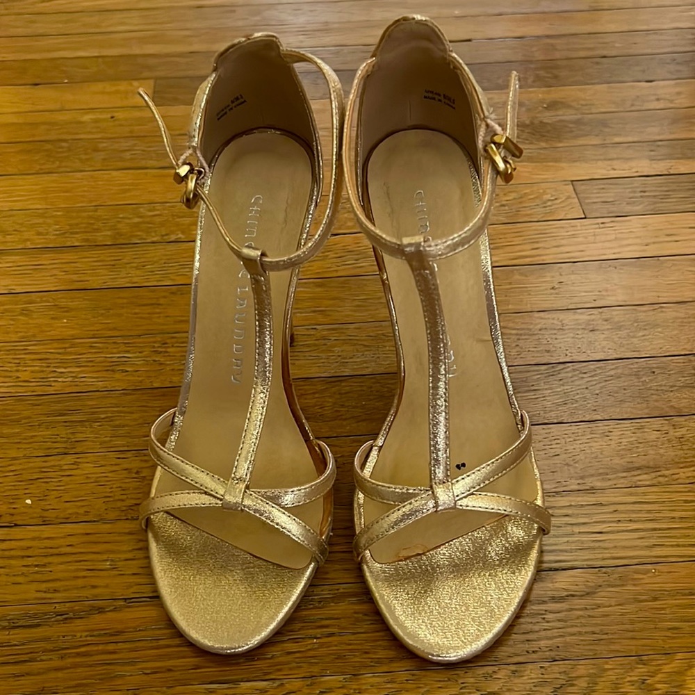 Gold high heels with front strap